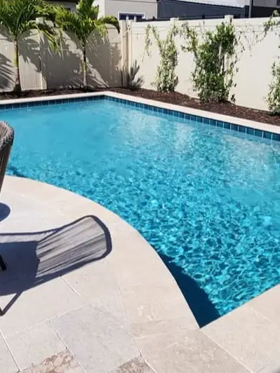 travertine deck — custom pool by Grunit