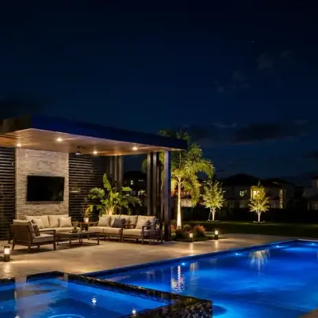 Nighttime pool and outdoor living by Grunit