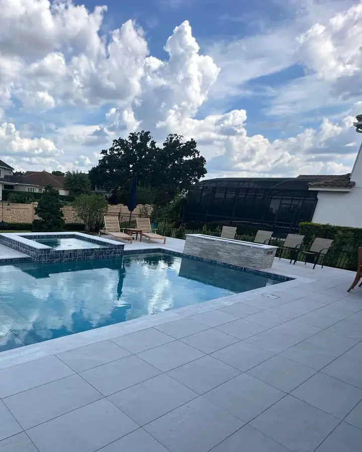 Palm-lined pool by Grunit — Windermere
