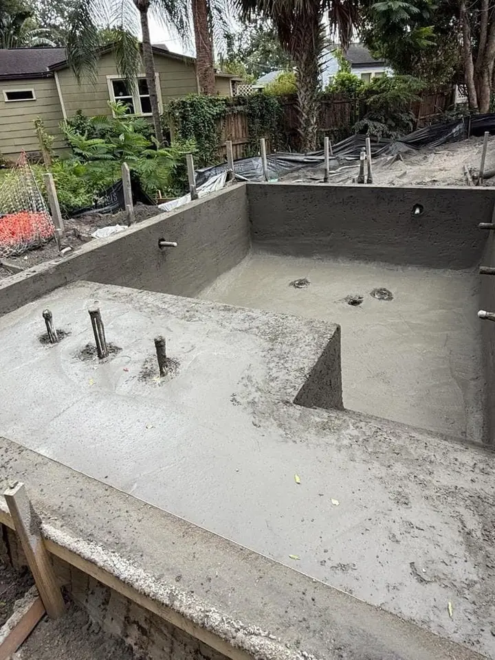 Gunite shell freshly shot — Seaview Street Residence pool build, Orlando