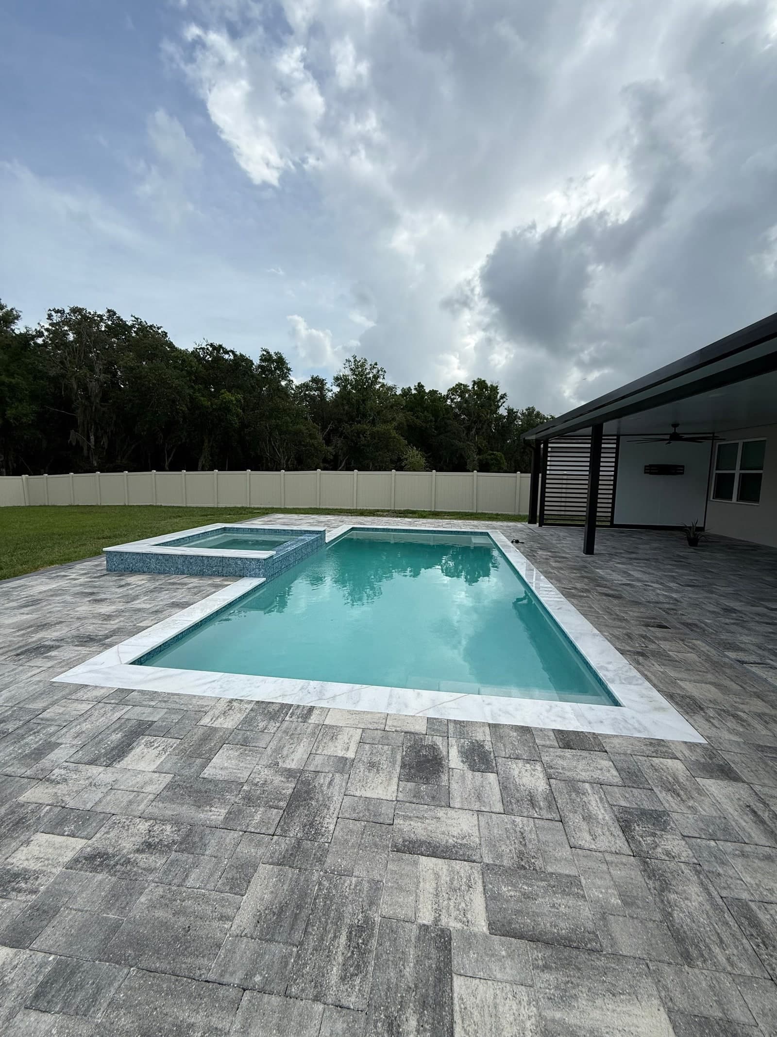 A Grunit craftsperson applying the pool shell finish during construction